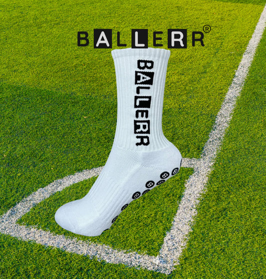 Ballerr premium grip sock displaying anti-slip design on a soccer field background for enhanced athletic performance.