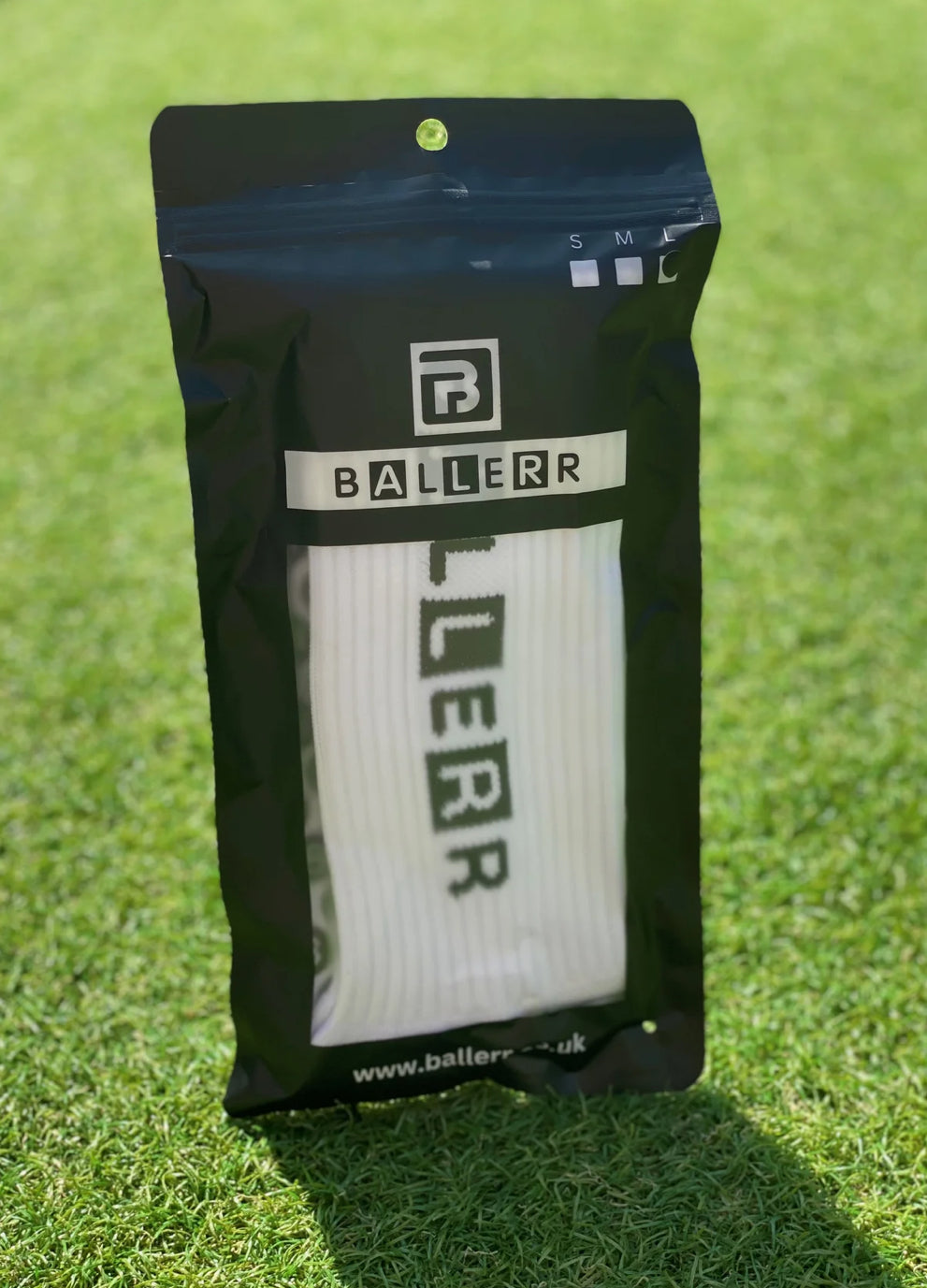 Ballerr Premium Grip Socks in packaging, designed for ultimate grip and performance in sports.