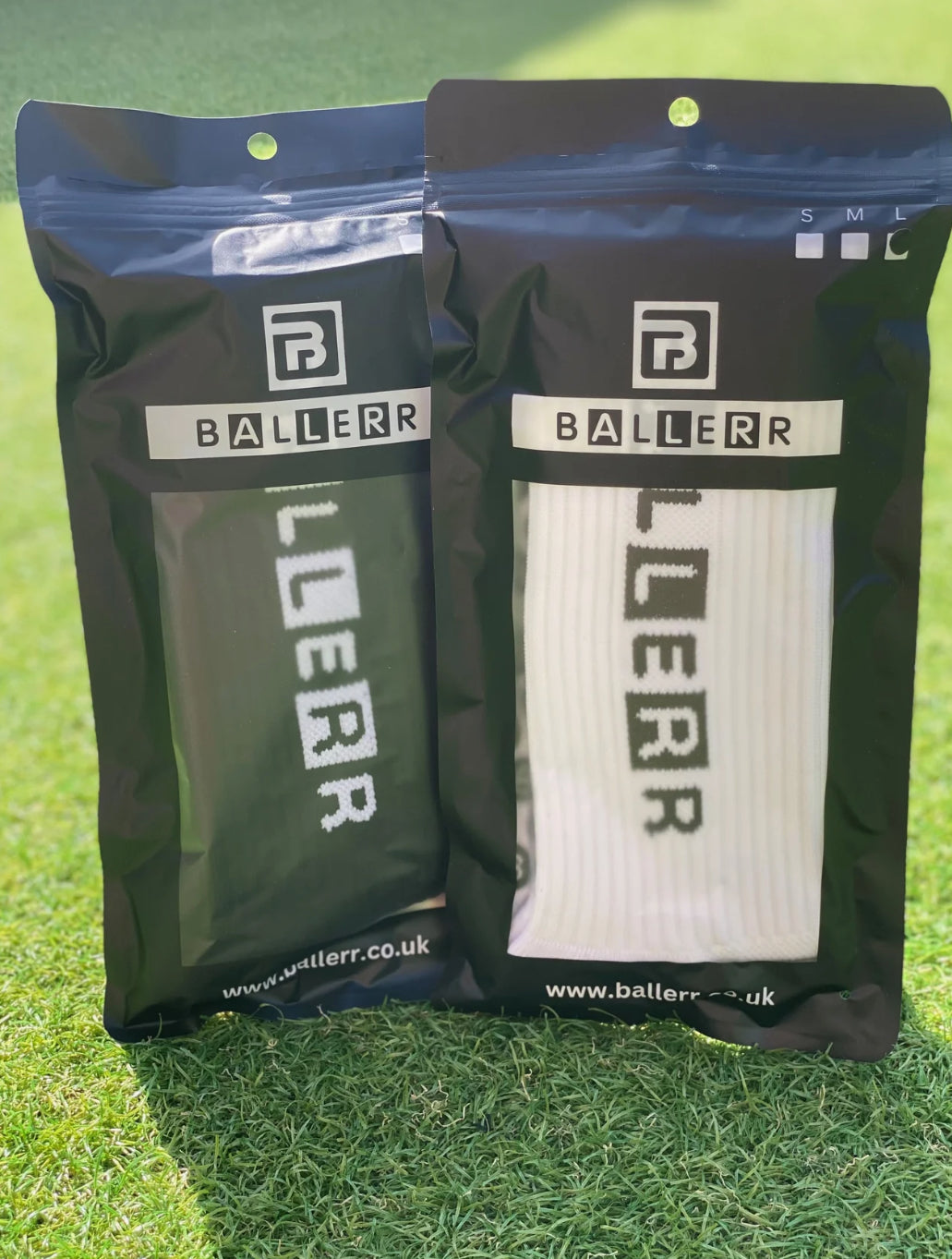 Ballerr Premium Grip Socks in packaged black and white designs, perfect for athletic performance and style.