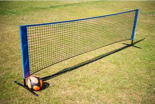 Football tennis net on grass with a soccer ball, ideal for indoor and outdoor play and easy to transport.