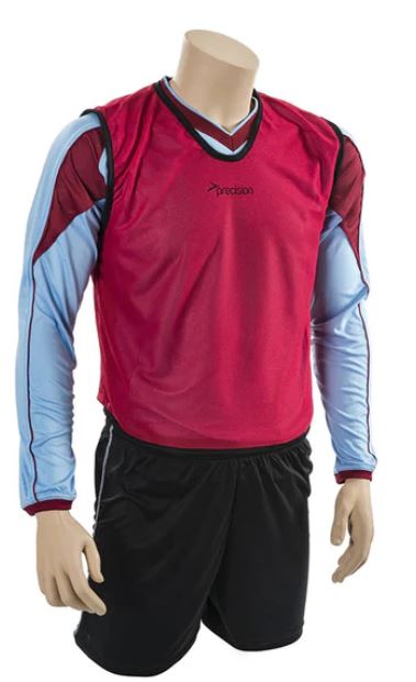 Red Precision Mesh Training Bib worn over a light blue long-sleeve shirt, ideal for sports practices and training sessions.